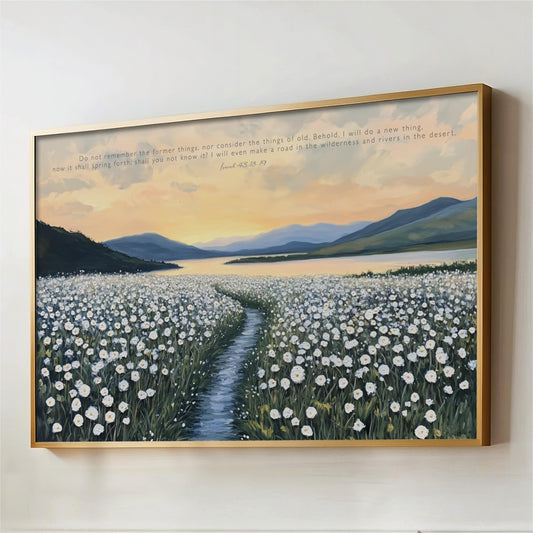 a serene landscape with a field of white flowers stretching out towards a body of water, surrounded by mountains in the distance. The sky is filled with warm, golden hues, suggesting either sunrise or sunset. The text overlay provides a biblical reference, reading "Do not forget the former things, nor consider the things of old, Behold! I will do a new thing, now it shall spring fortheth and not know it! Let it make a road in the wilderness and rivers in the desert."