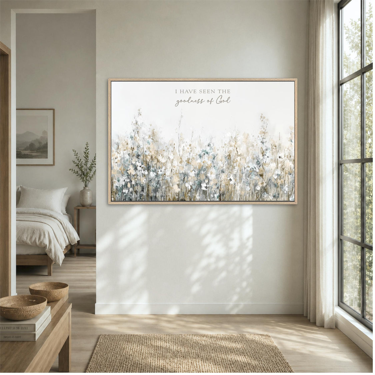 a large framed painting of a field of flowers hanging on a wall in a bedroom.