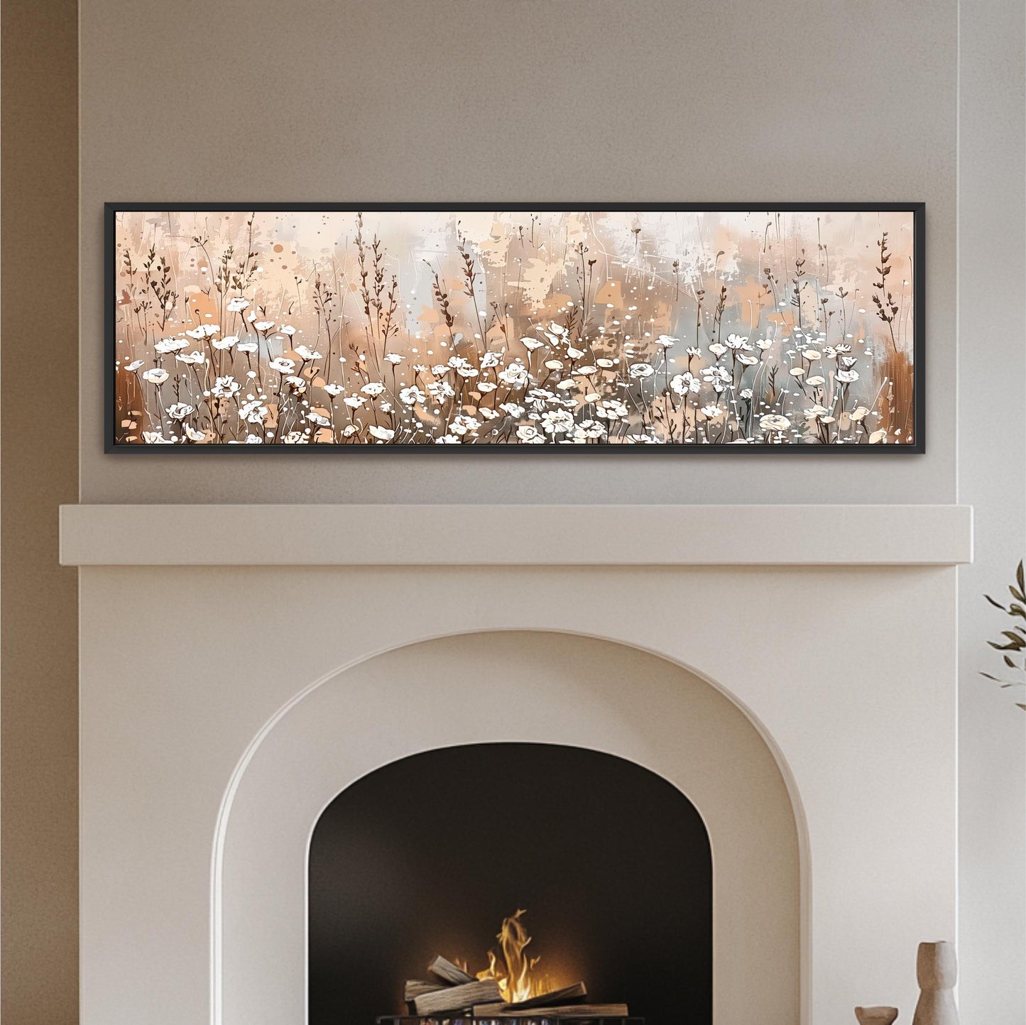 a fireplace with a framed painting of a field of flowers above it.
