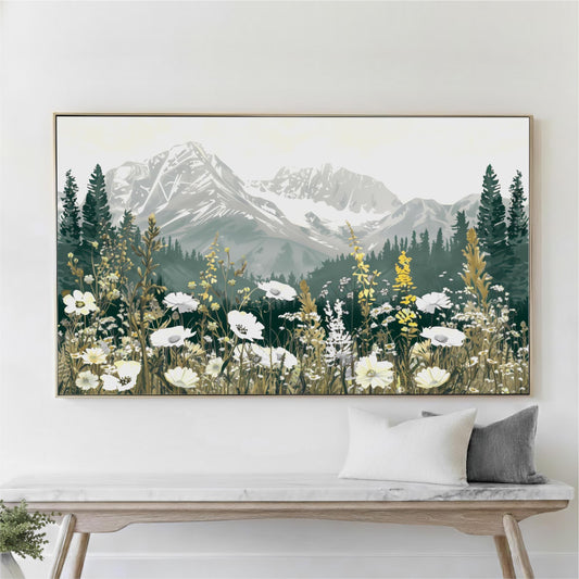 a large framed painting of a mountain landscape with a meadow of white flowers in the foreground.