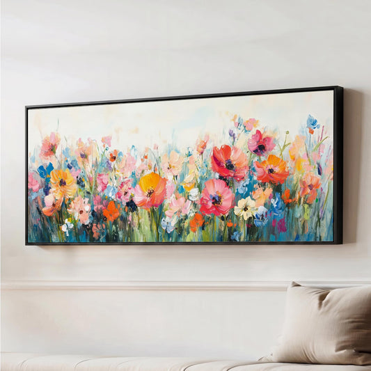 Bring the beauty of a blooming wildflower meadow into your home with this vibrant wildflower canvas wall art. Featuring a soft, painterly effects with a blend of florals in warm corals, blush pinks, soft blues, and fresh greens, this piece captures the effortless charm of nature in full bloom.