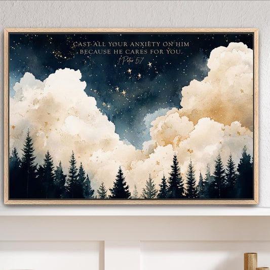 a framed painting of a serene landscape with a forest and a starry night sky. The painting is hung on a wall above a wooden shelf, which has a white bowl, a vase, and some decorative items. The text on the painting reads "Cast all your anxiety on Him because he cares for you."