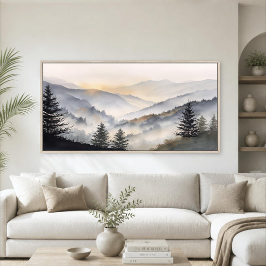 a large framed landscape painting hanging on a wall above a white sofa in a living room.