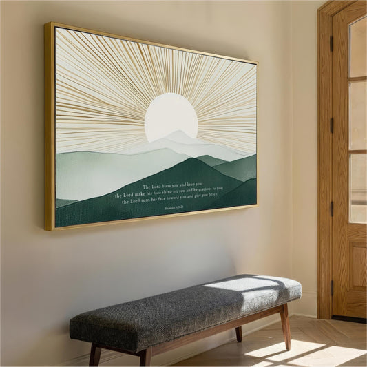 a large framed artwork depicting a serene landscape with a sun rising over a mountain range, hanging on a wall in a room with a wooden door and a bench.