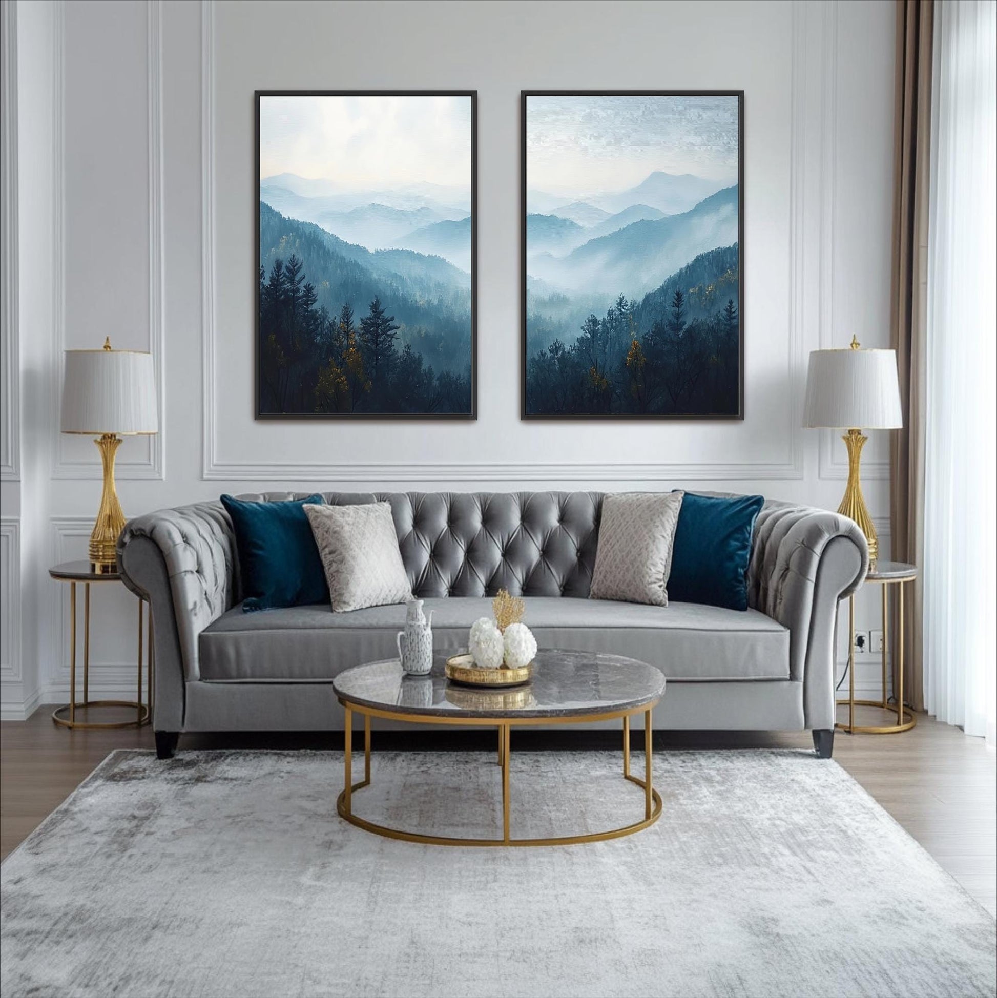 a modern living room with a gray tufted sofa, a round glass coffee table, and two framed landscape paintings on the wall above the sofa.
