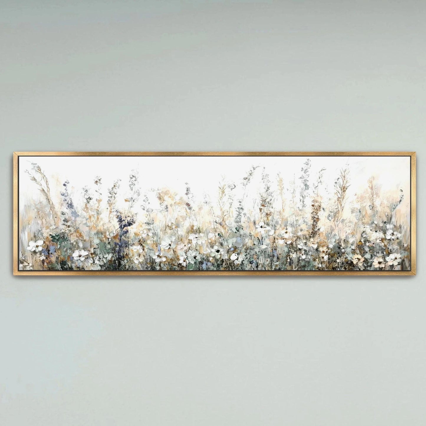 A framed painting depicting a field of flowers with a pale blue sky in the background.