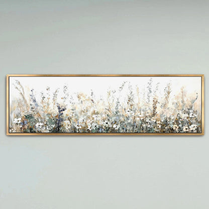 A framed painting depicting a field of flowers with a pale blue sky in the background.