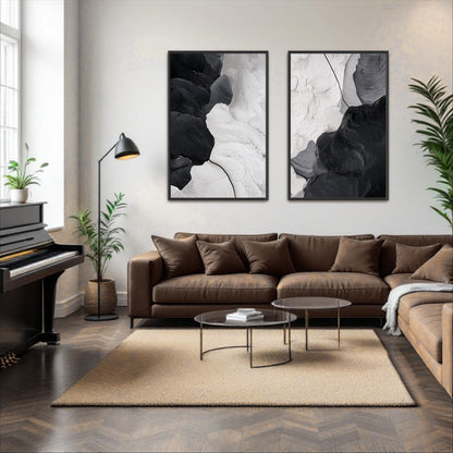 a modern living room with a brown leather sofa, a glass coffee table, and two abstract paintings on the wall.