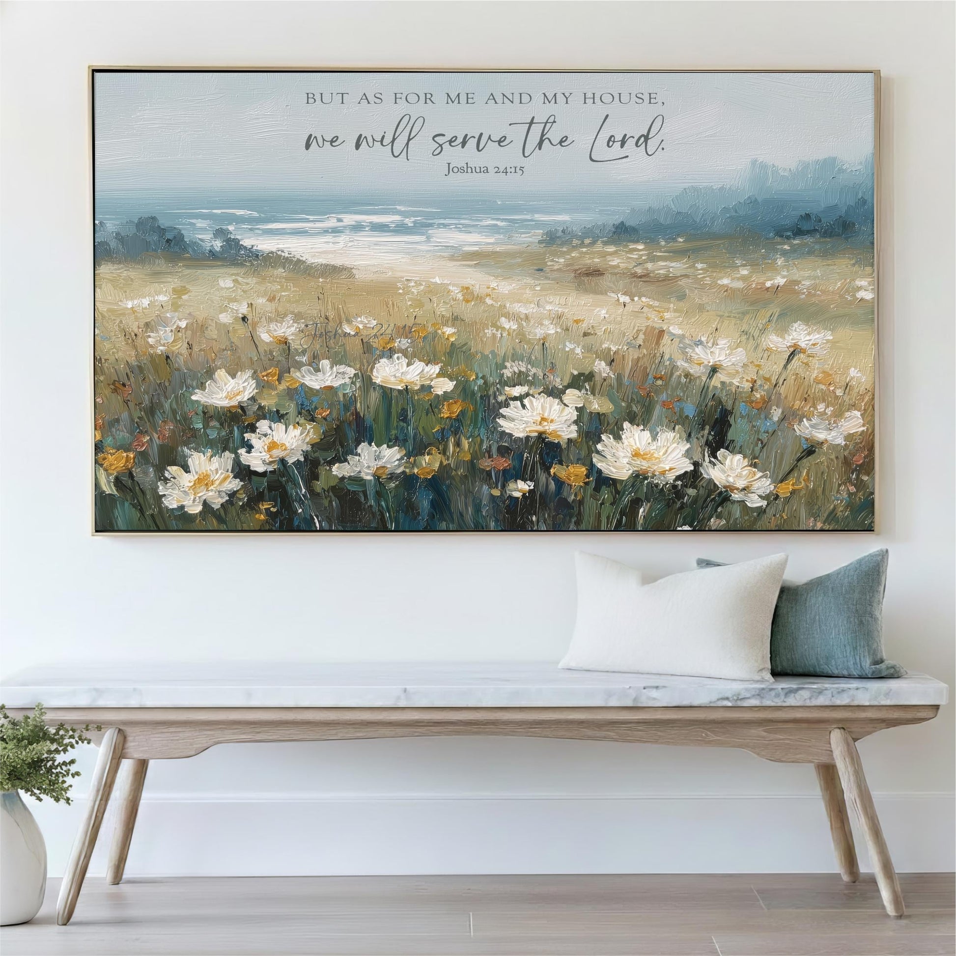 a large painting of a field of flowers hanging on a wall above a wooden bench.