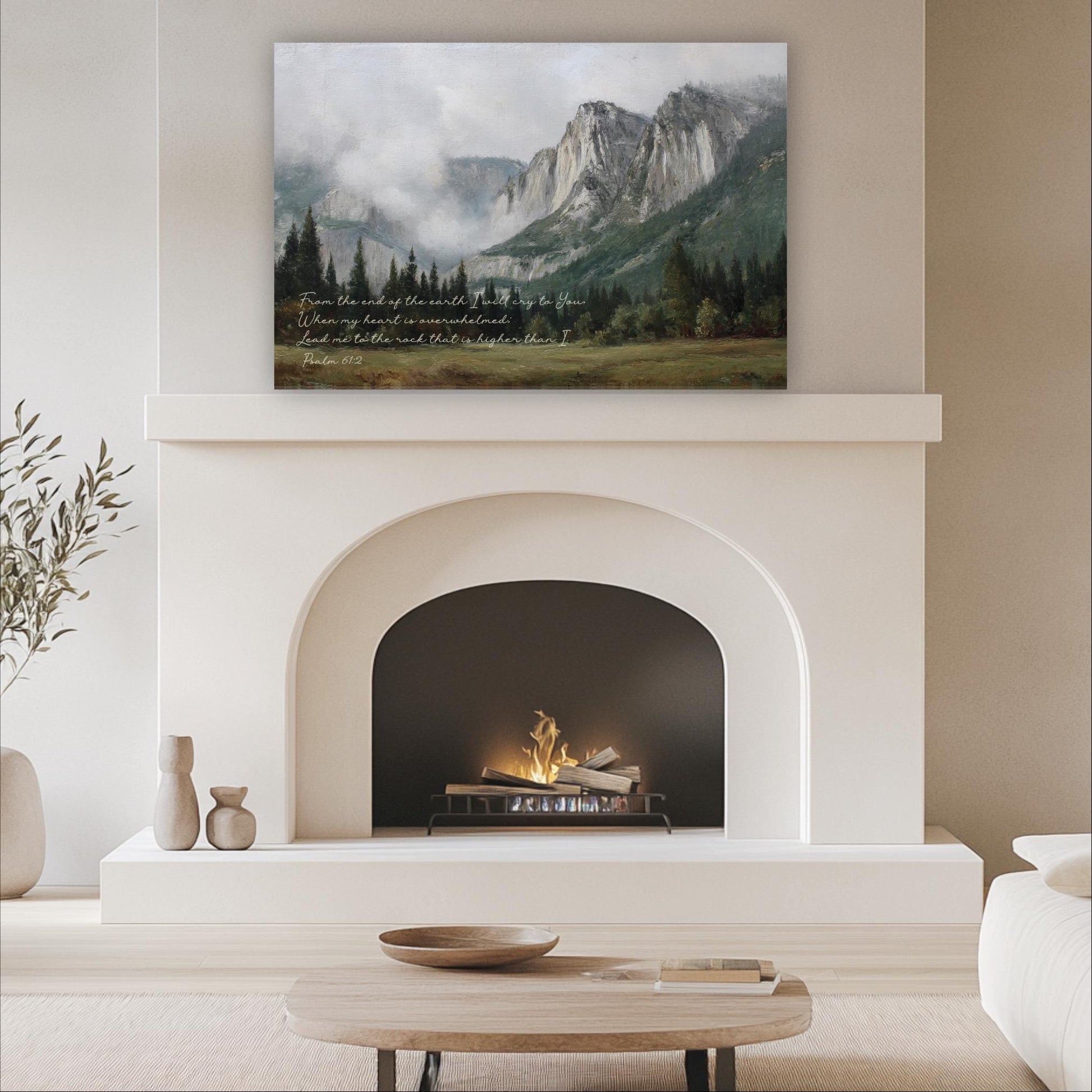 a cozy living room with a fireplace, a wooden coffee table, and a painting of a mountain landscape above it.