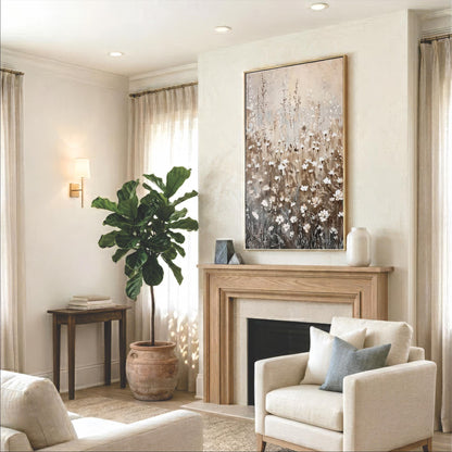 a cozy living room with a fireplace, a large potted plant, and a painting on the wall. The room is furnished with a sofa, a chair, and a coffee table, creating a comfortable and inviting atmosphere.