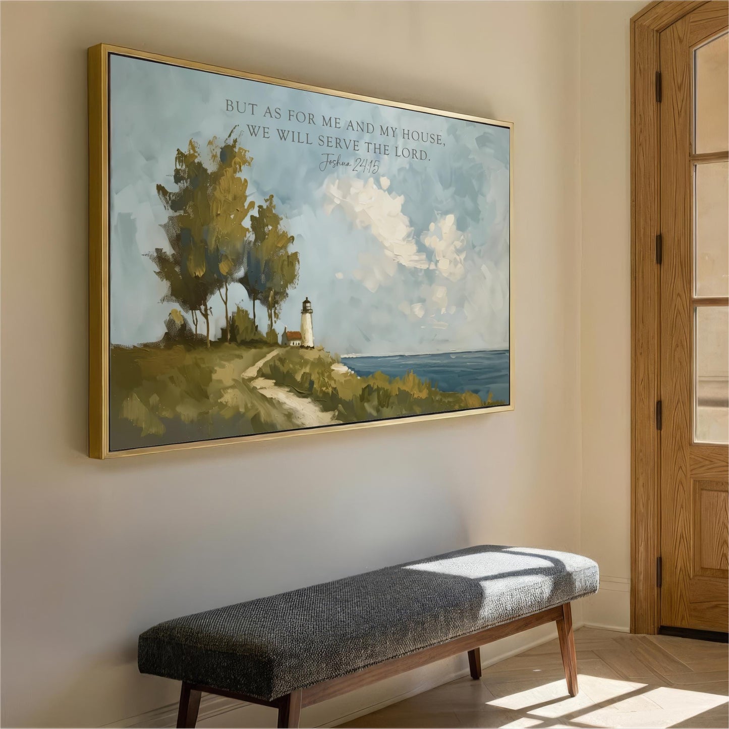 a large painting of a lighthouse on a cliff overlooking the ocean, hanging on a wall above a gray bench.