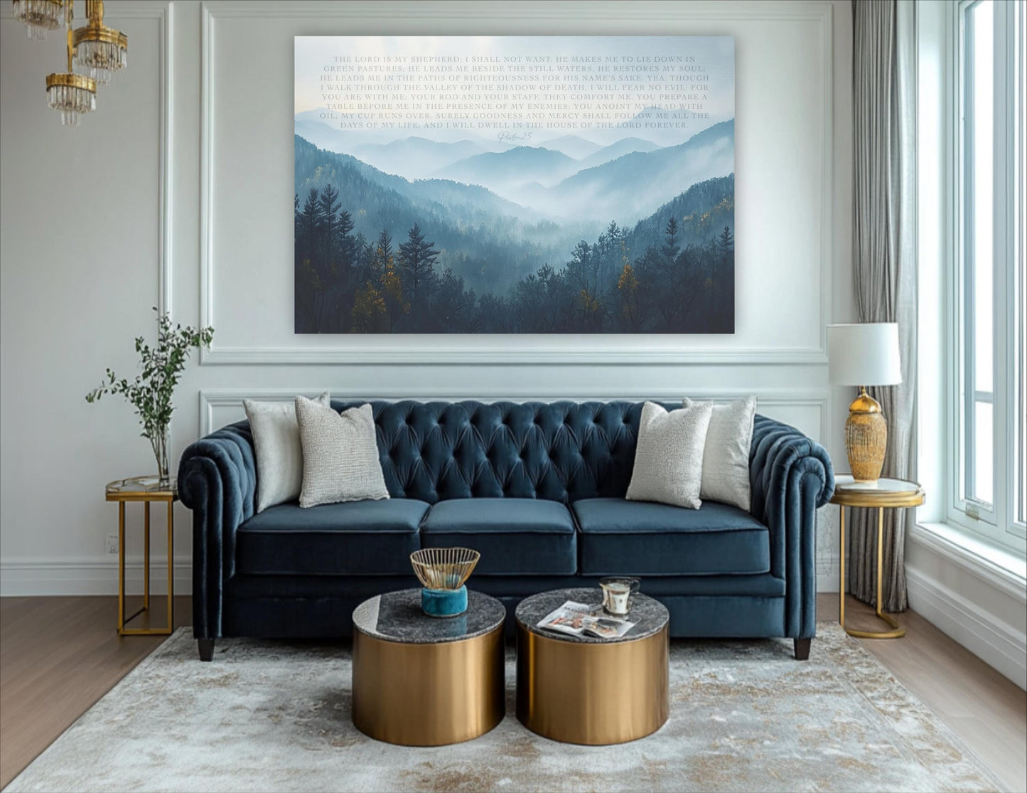a living room with a blue tufted sofa, two round coffee tables, and a large landscape painting on the wall depicting a mountain range.