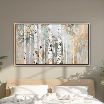 a large, framed painting of birch trees hanging on a wall above a bed with white pillows.