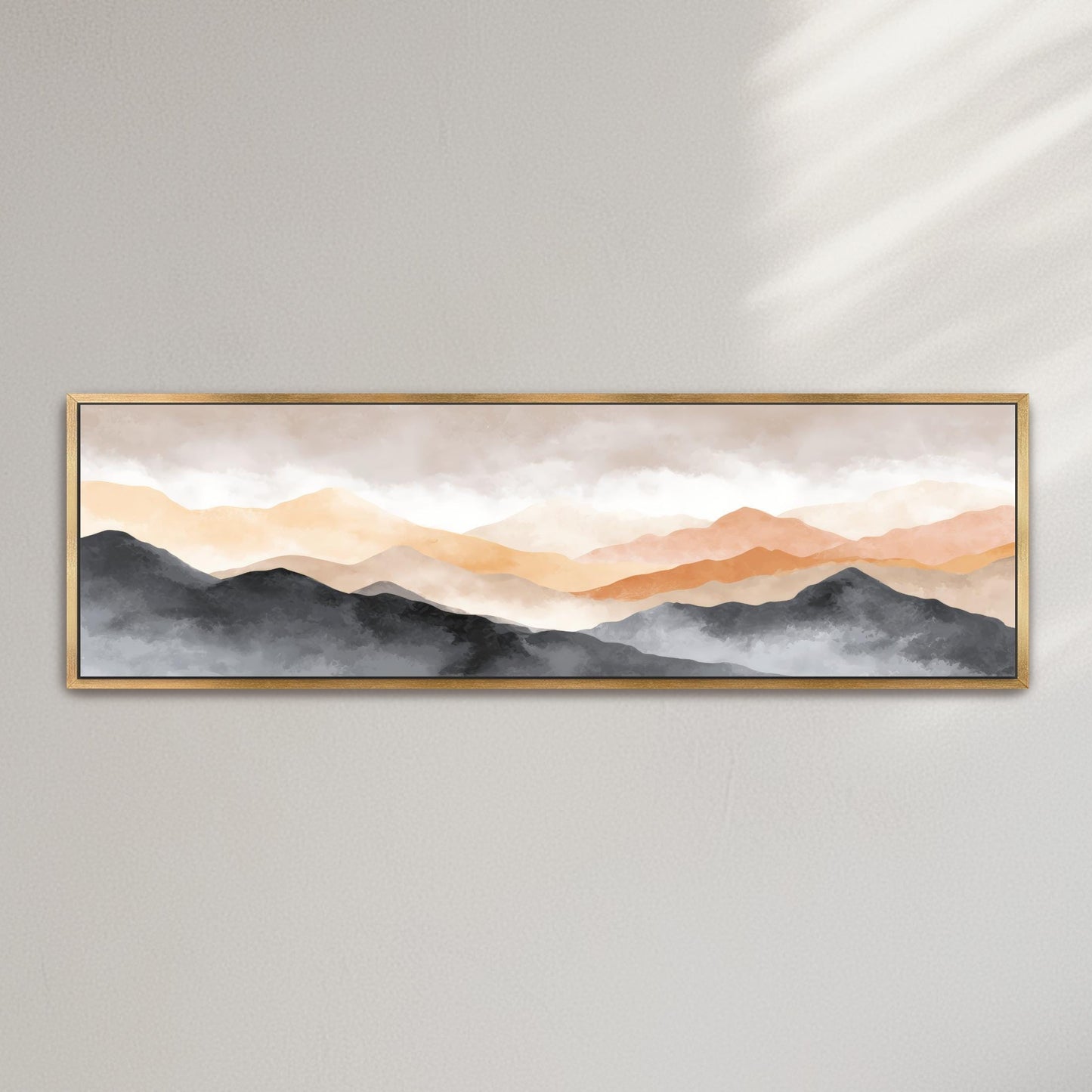 The image is a framed painting depicting a serene landscape of mountains with a hazy, golden-orange sky.