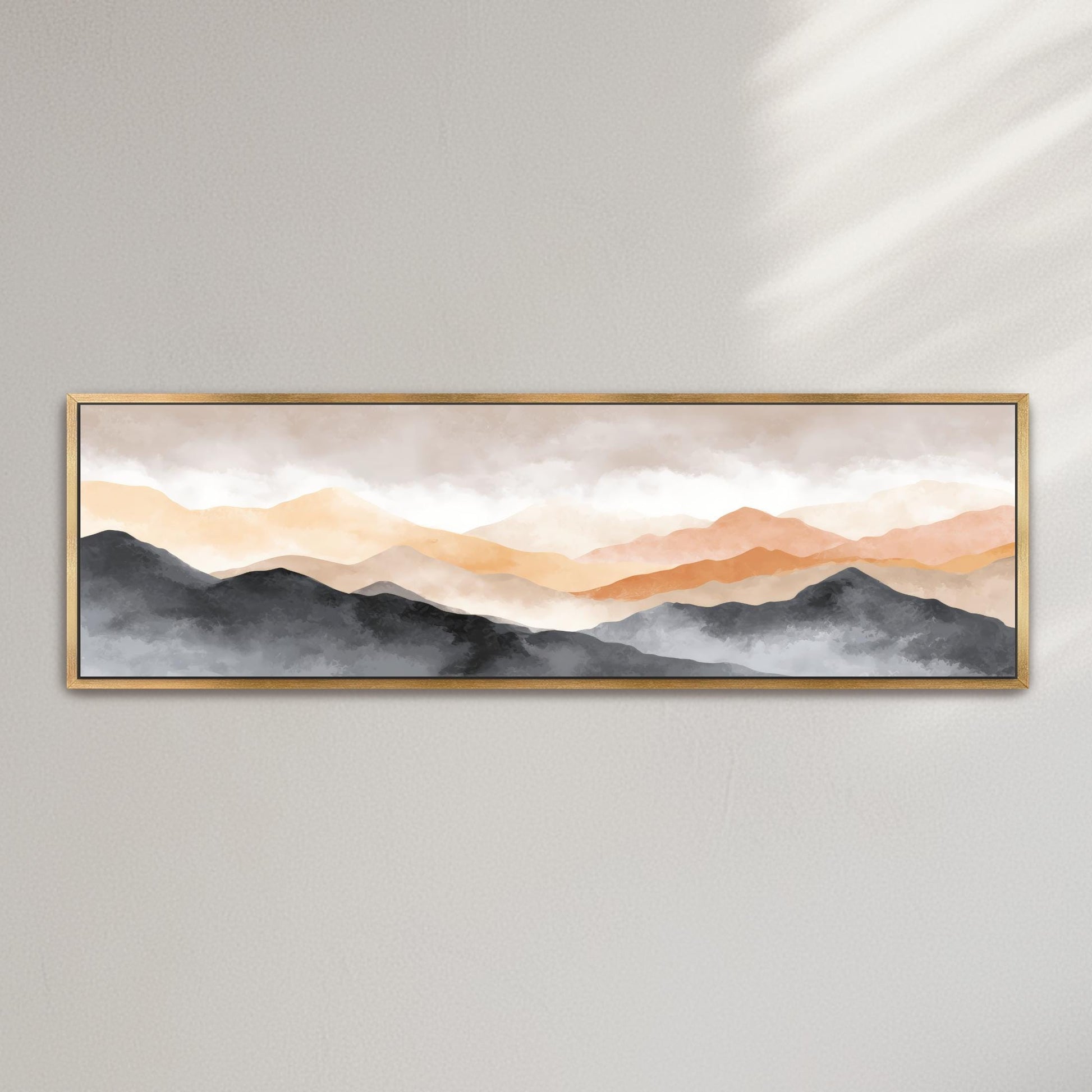 The image is a framed painting depicting a serene landscape of mountains with a hazy, golden-orange sky.