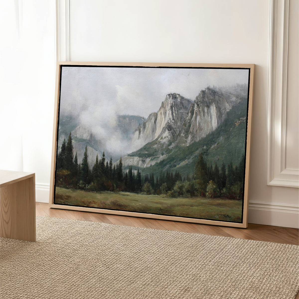 a large landscape painting depicting a mountainous, forested scene with a misty, hazy atmosphere.