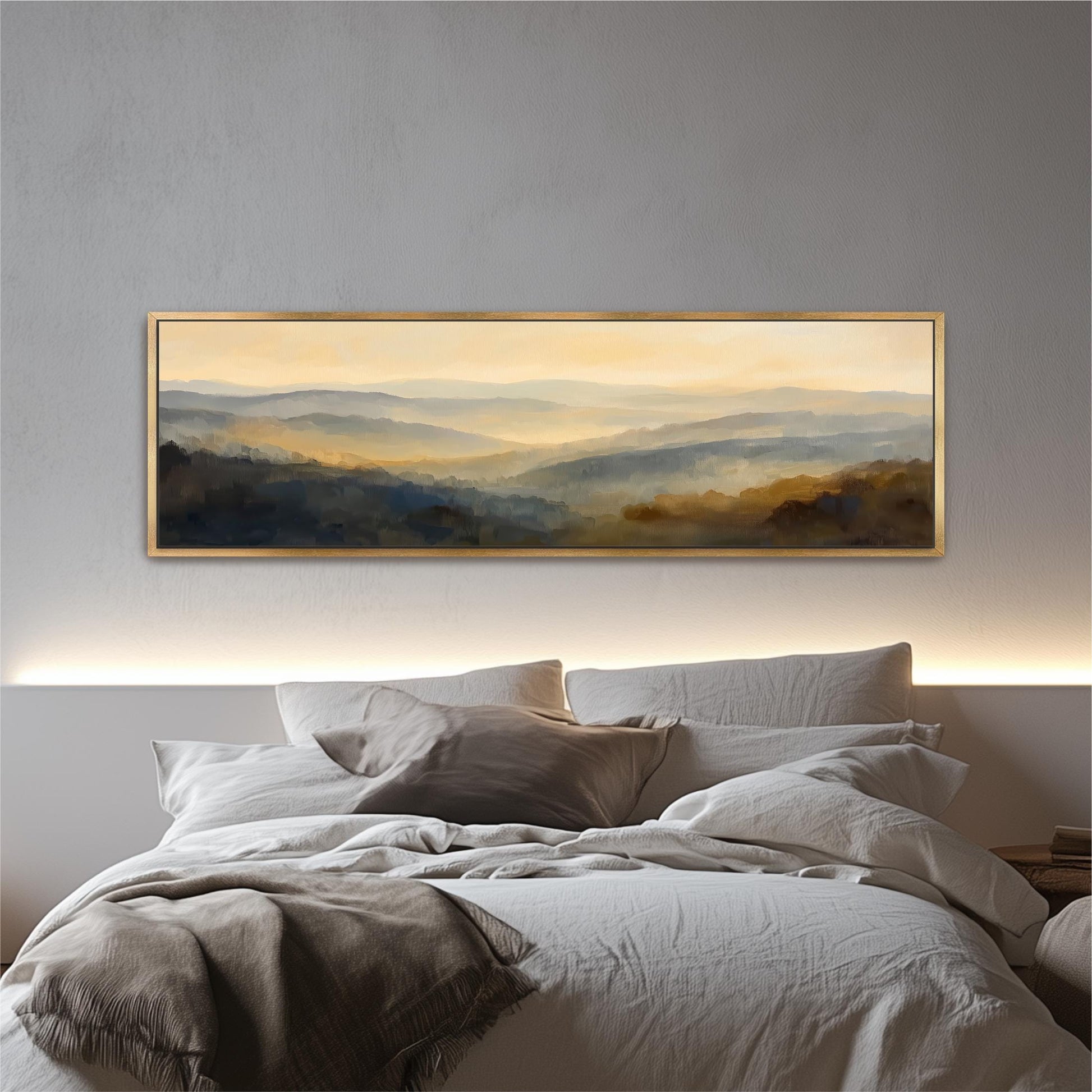 a large, framed landscape painting hanging above a bed with white bedding.