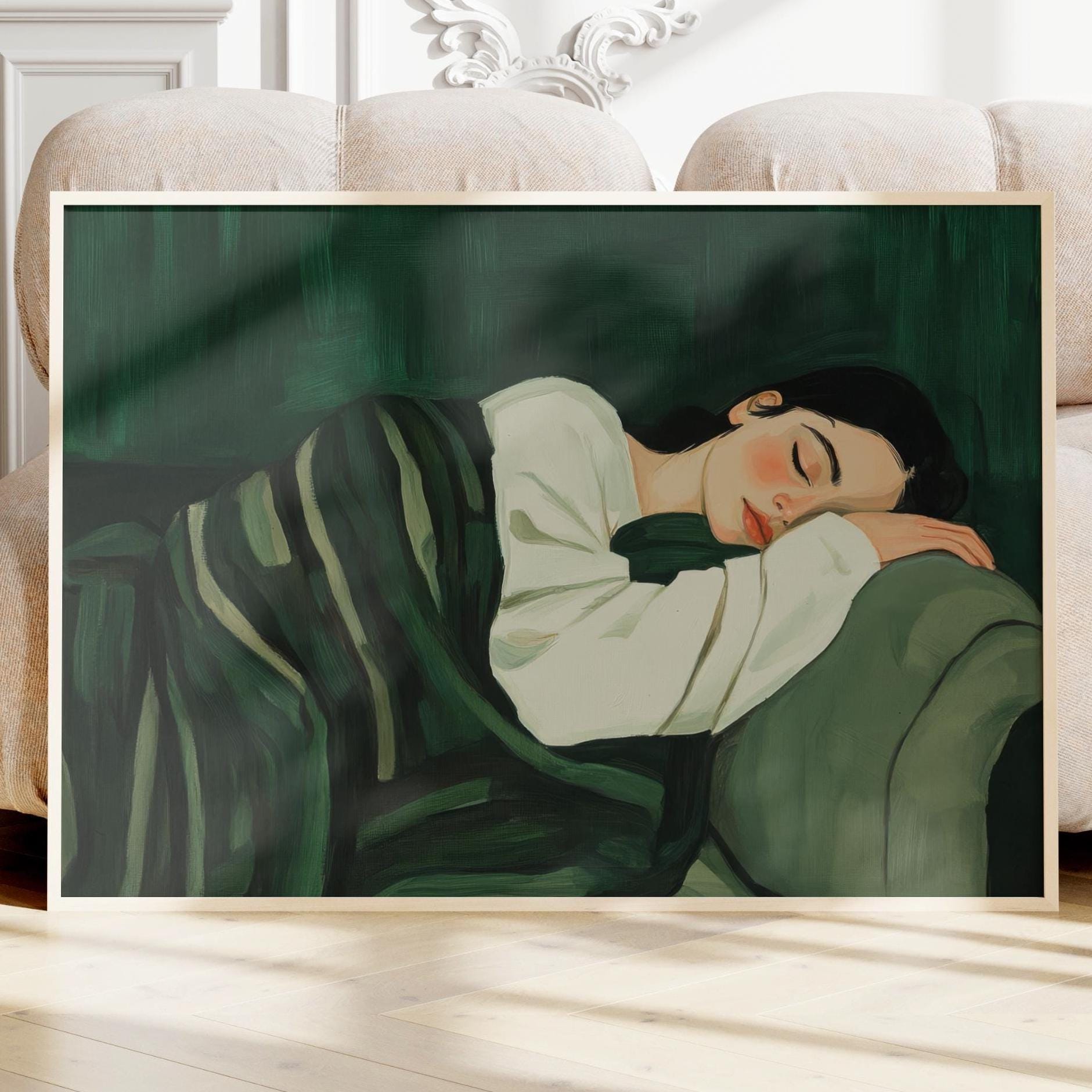 painting of a woman laying on a couch stripe blanket emerald green