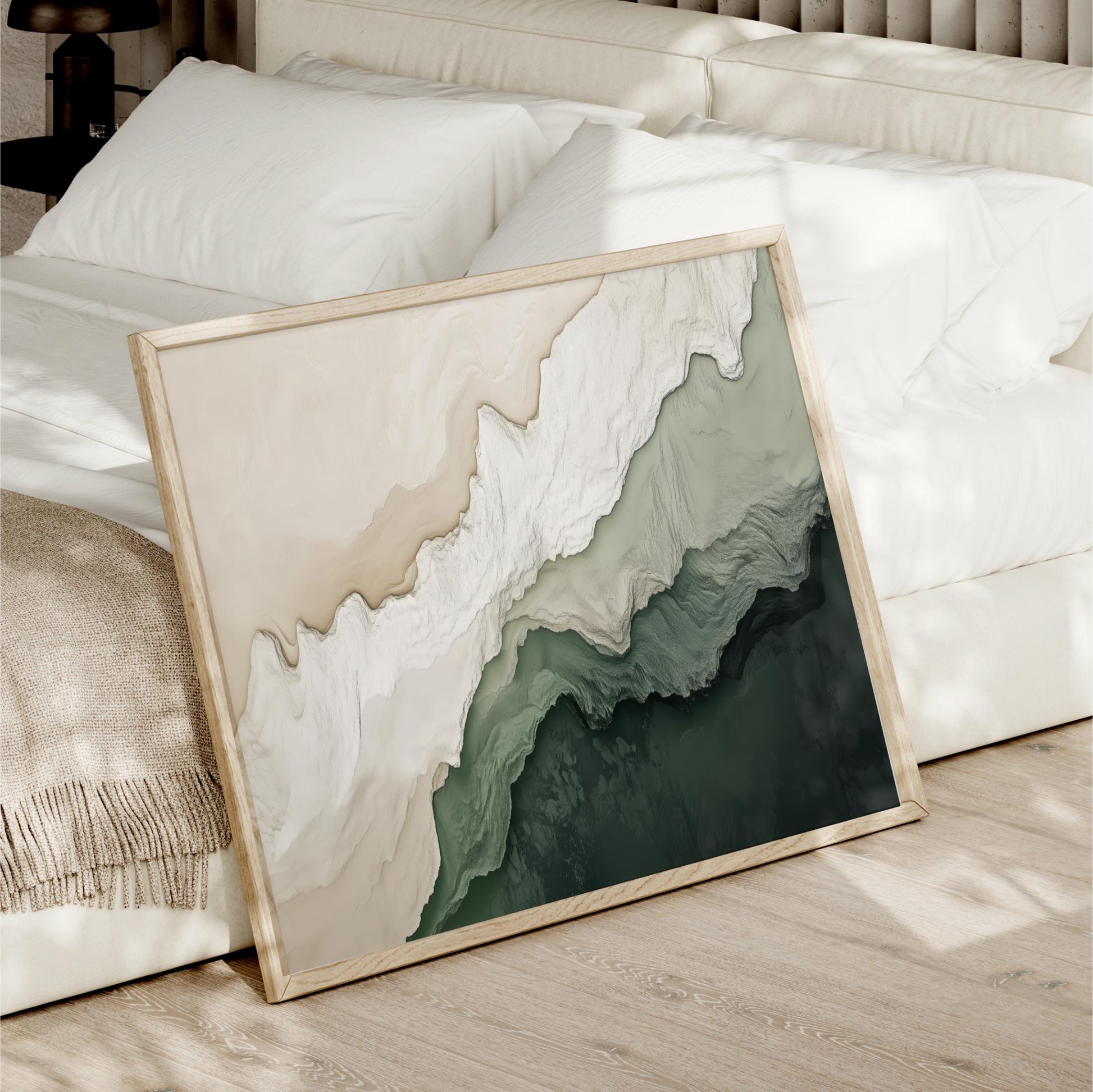a large abstract painting with a mix of green and white colors, displayed on a wooden floor in front of a white bed.