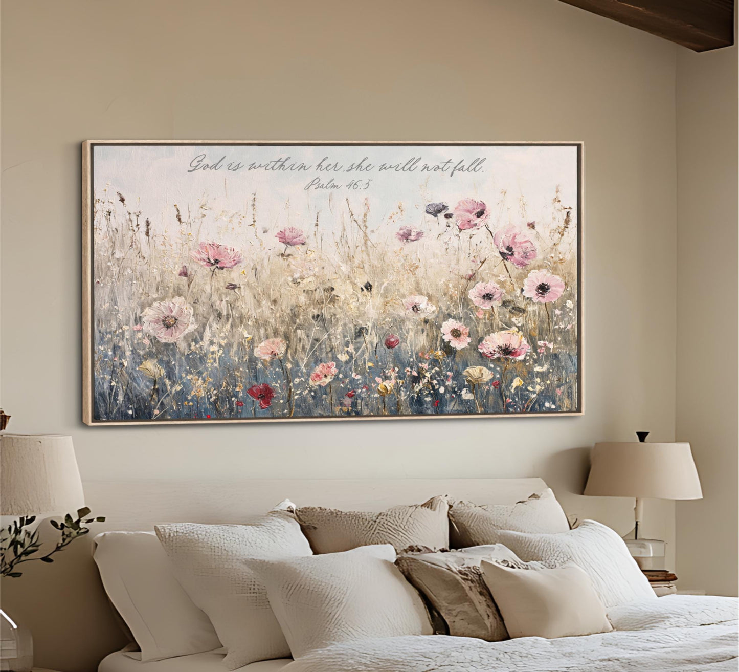 A large framed painting of a field of flowers hangs on the wall above a bed with white pillows and a beige headboard.