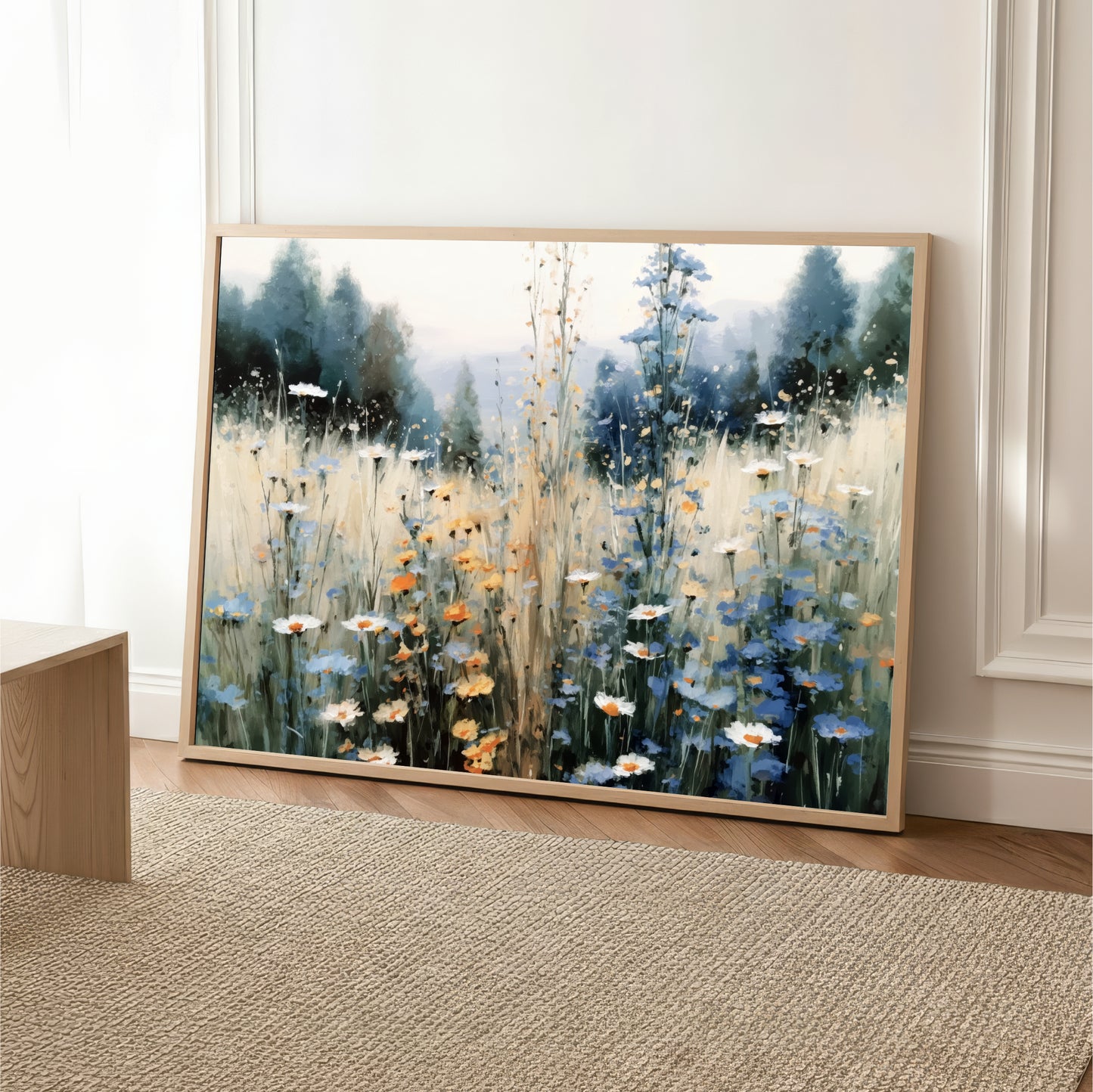 a large painting of a field of flowers, with a mix of blue, orange, and white flowers. The painting is framed and displayed on a wall, creating a serene and natural atmosphere.