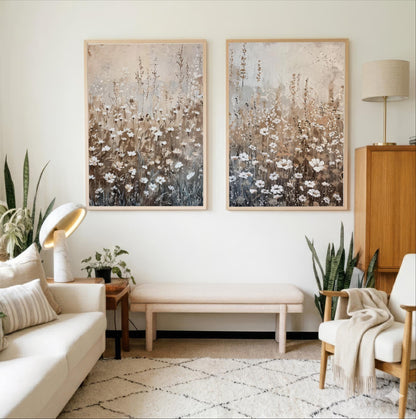 a cozy living room with a white sofa, a wooden side table, and two framed paintings of flowers hanging on the wall.