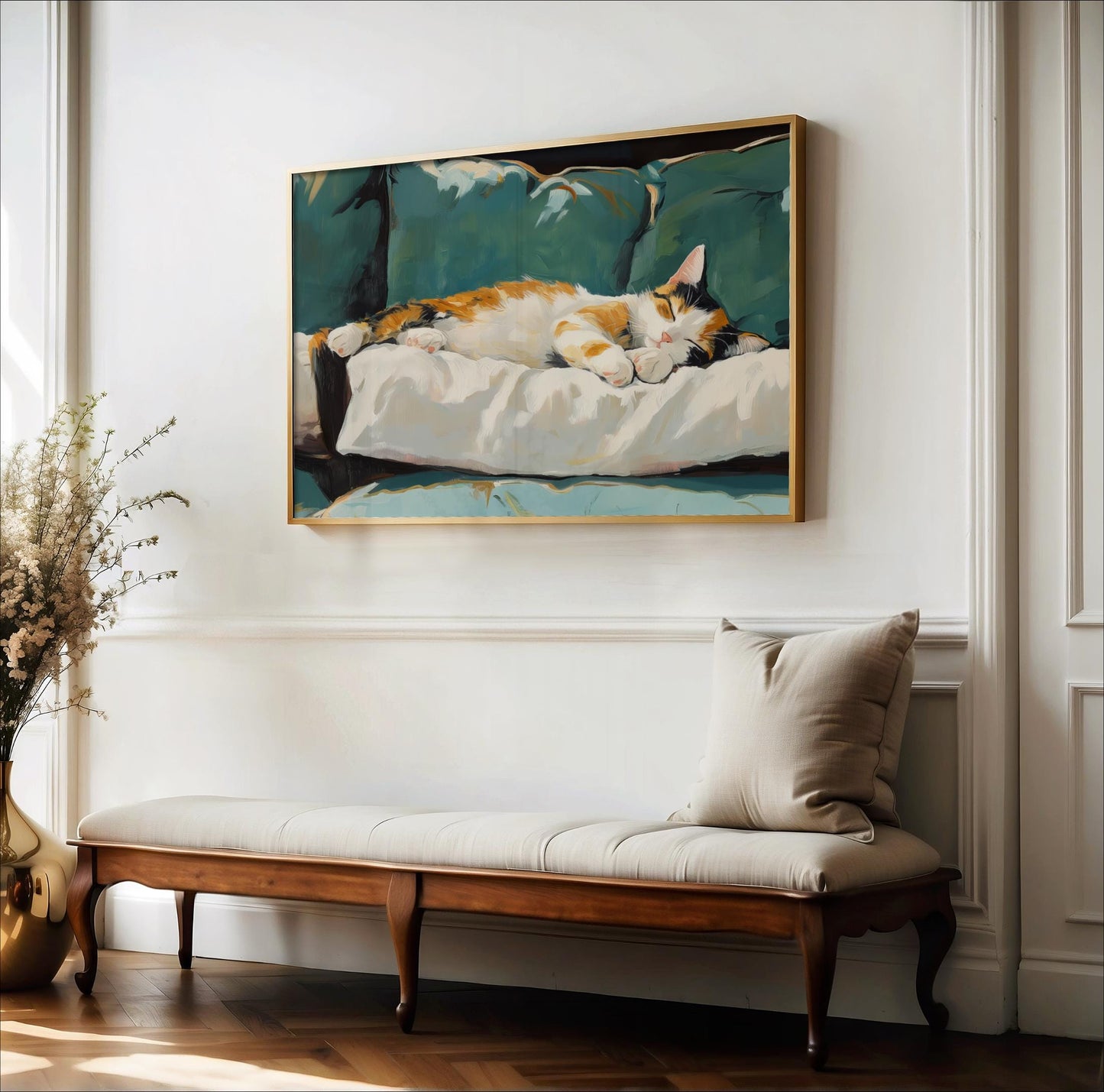 a painting of a cat sleeping on a couch, hanging on a white wall above a wooden bench with a beige cushion.