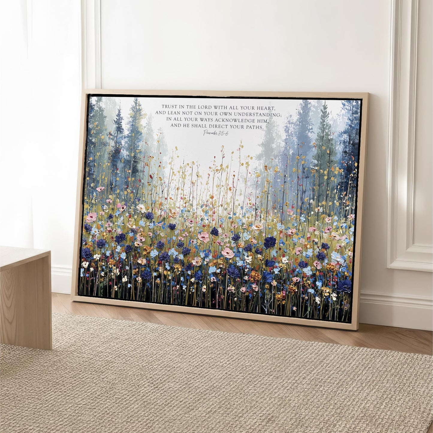 The image is a framed painting depicting a serene landscape with a field of flowers and trees.