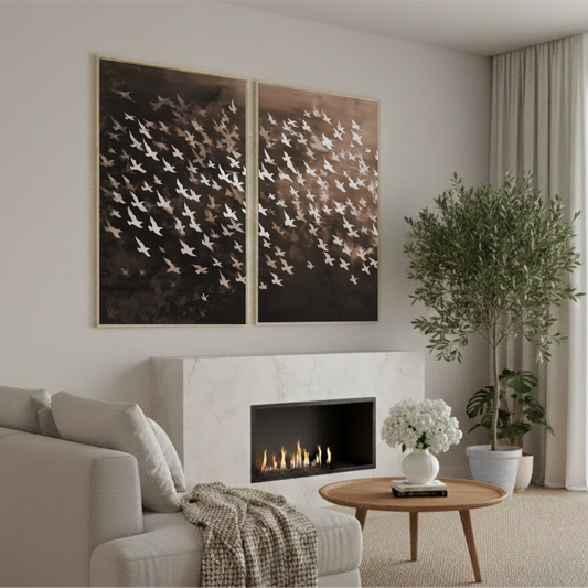 a cozy living room with a fireplace, a comfortable sofa, and a coffee table with a vase of white flowers. The room is decorated with a large abstract painting of birds on the wall, and there are potted plants and a bookshelf in the space.
