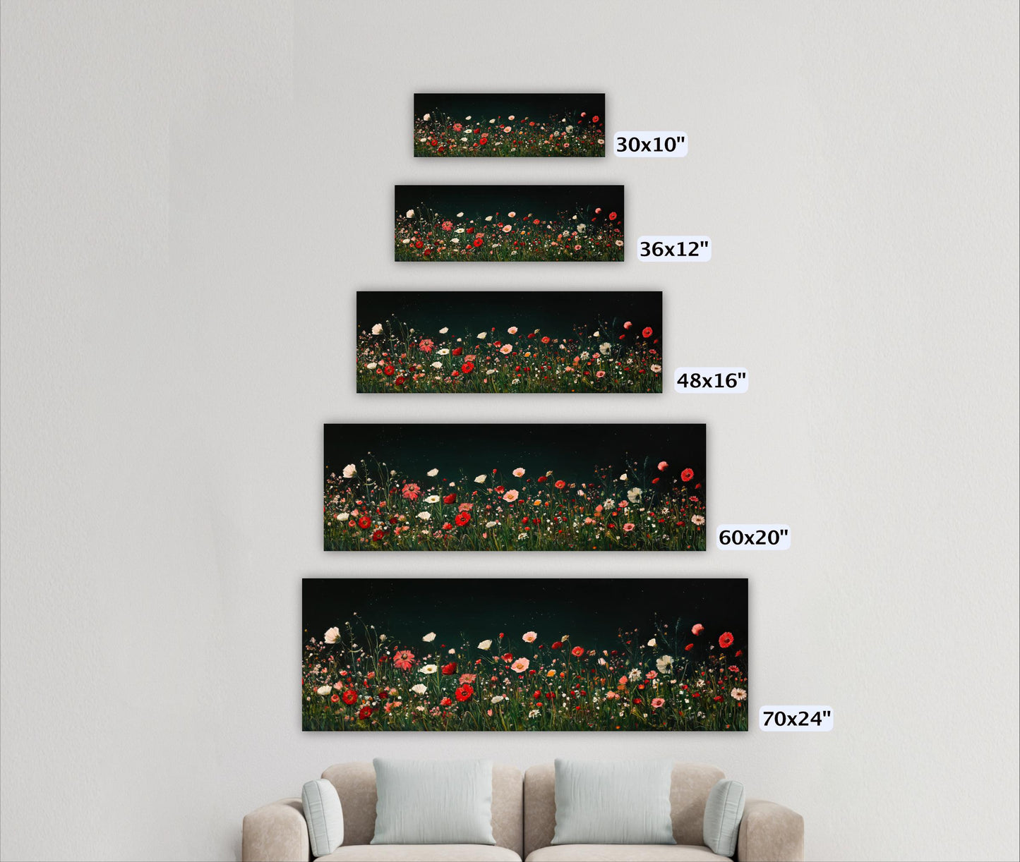 a living room with a couch and three pictures on the wall