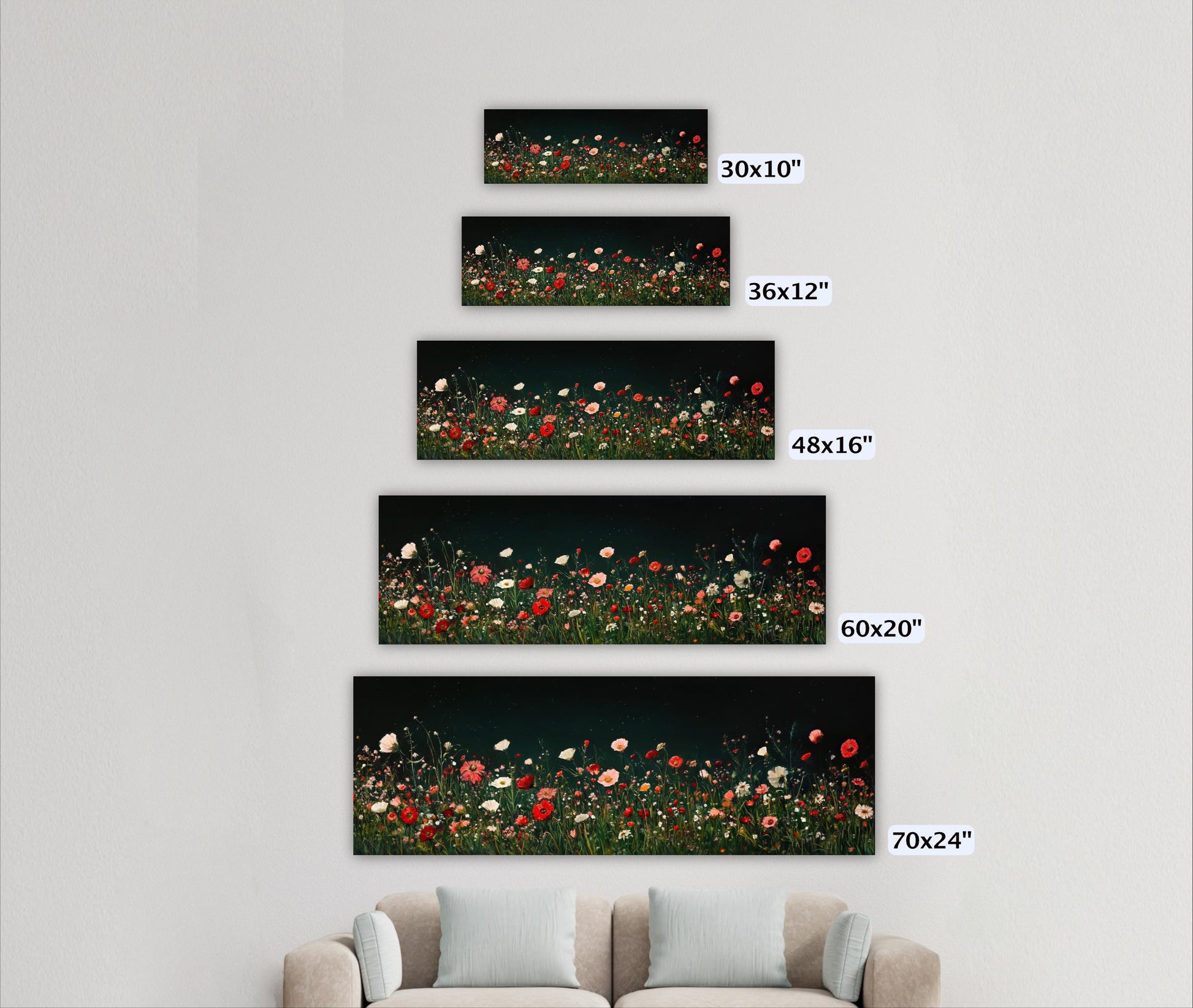 a living room with a couch and three pictures on the wall