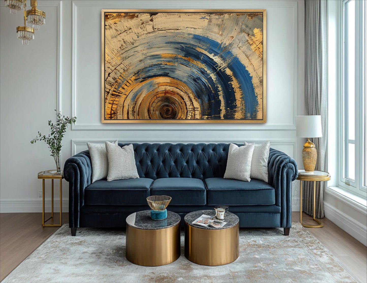 a living room with a blue couch and a painting on the wall