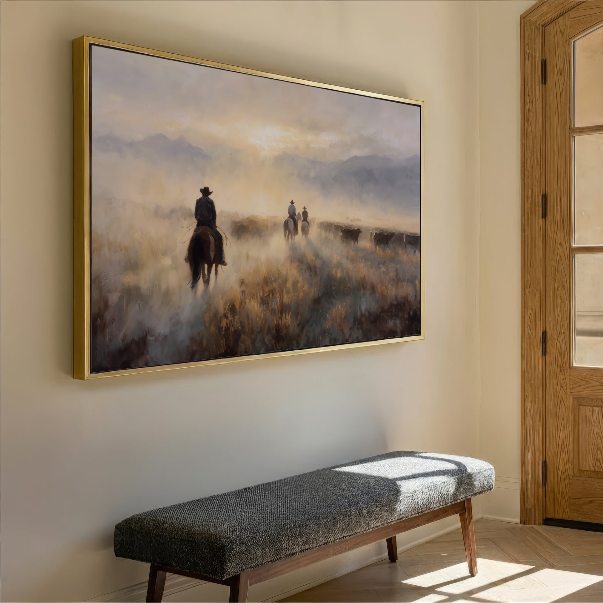 a large painting of a cowboy riding a horse in a field, with a bench in the foreground.