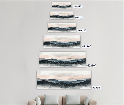 a series of landscape paintings or prints displayed on a wall, each with a different size. The paintings depict mountains and a sky with clouds, and they are arranged in a descending order from largest to smallest.