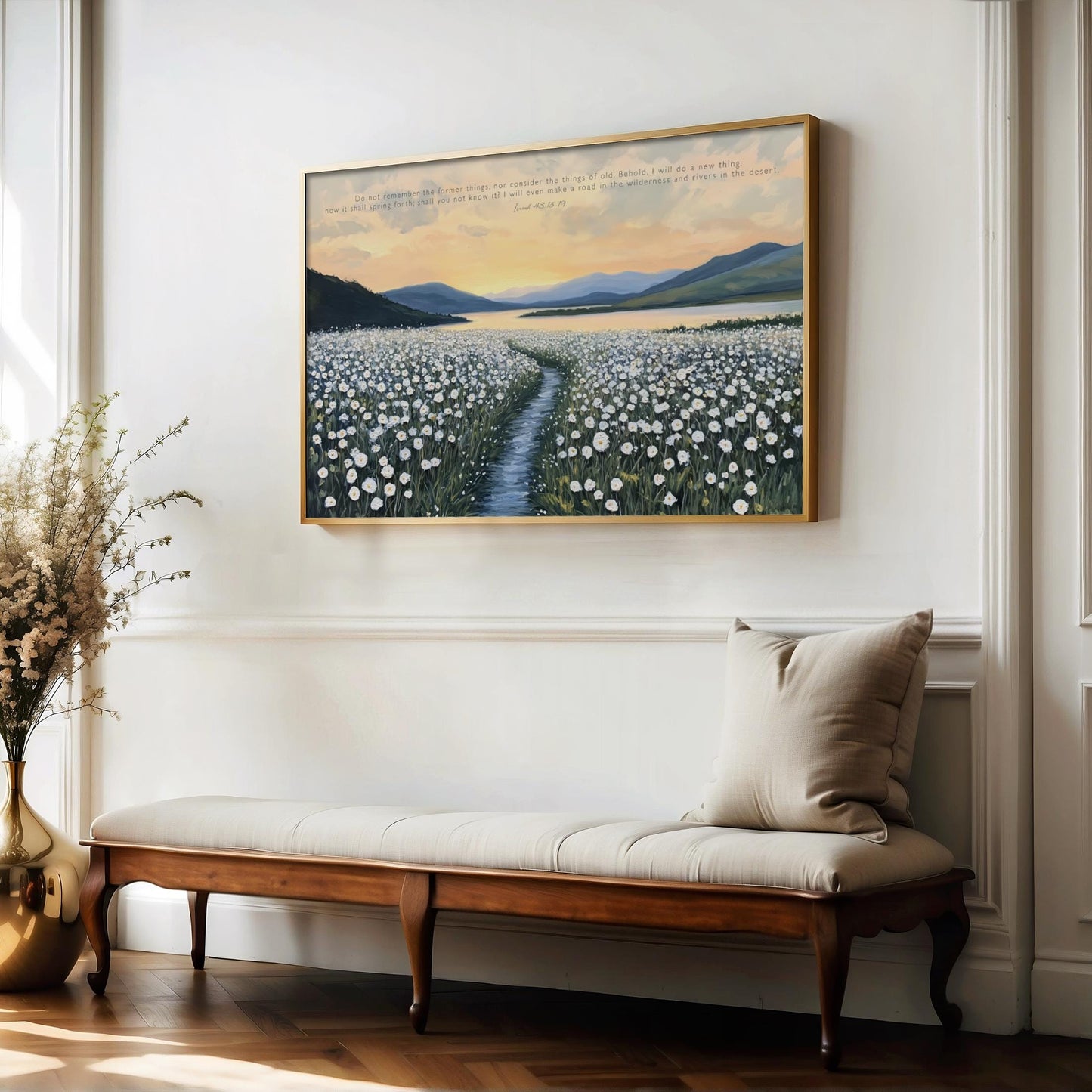 a serene indoor setting with a large painting of a field of flowers hanging on the wall above a wooden bench. The painting depicts a winding path leading through the field, with a picturesque sunset in the background. The bench is positioned in front of the painting, creating a cozy and inviting atmosphere in the room.