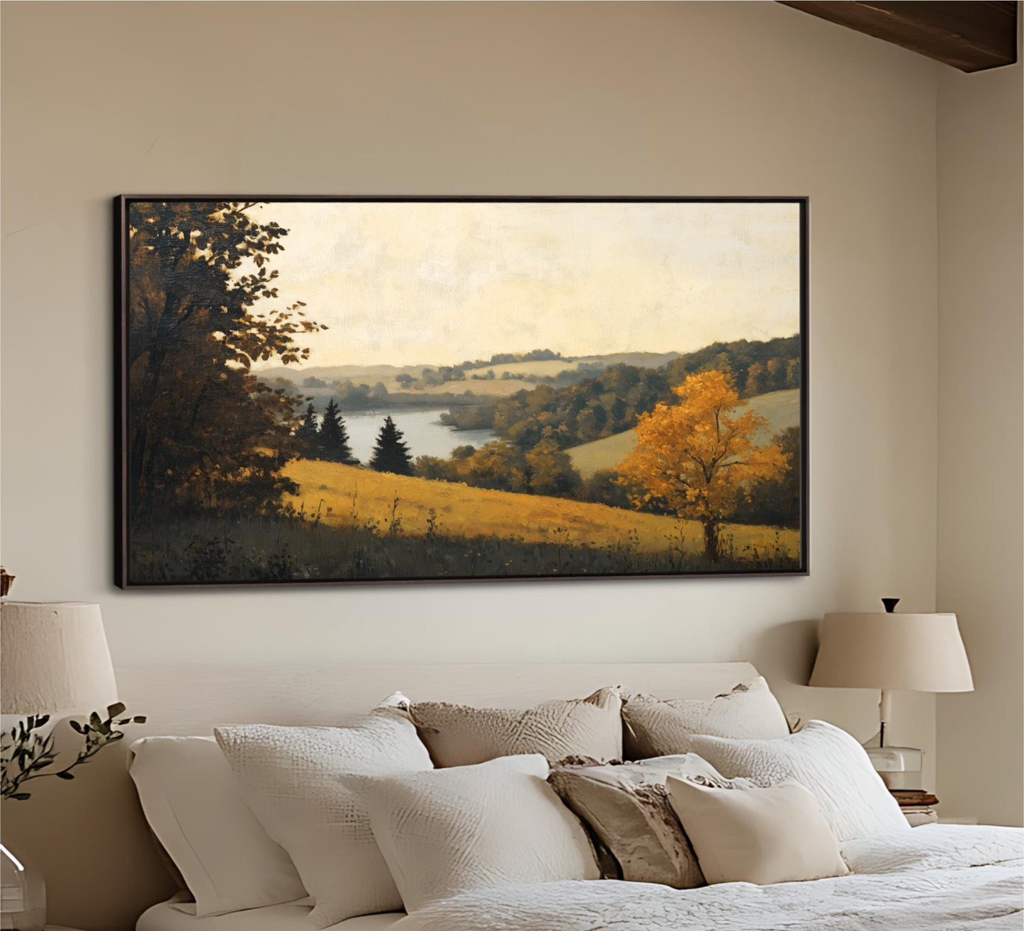a large landscape painting hanging on a wall above a bed with white bedding.