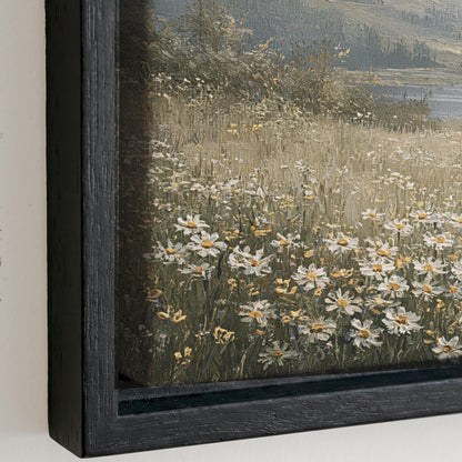 a field of white and yellow flowers, with a body of water visible in the background.