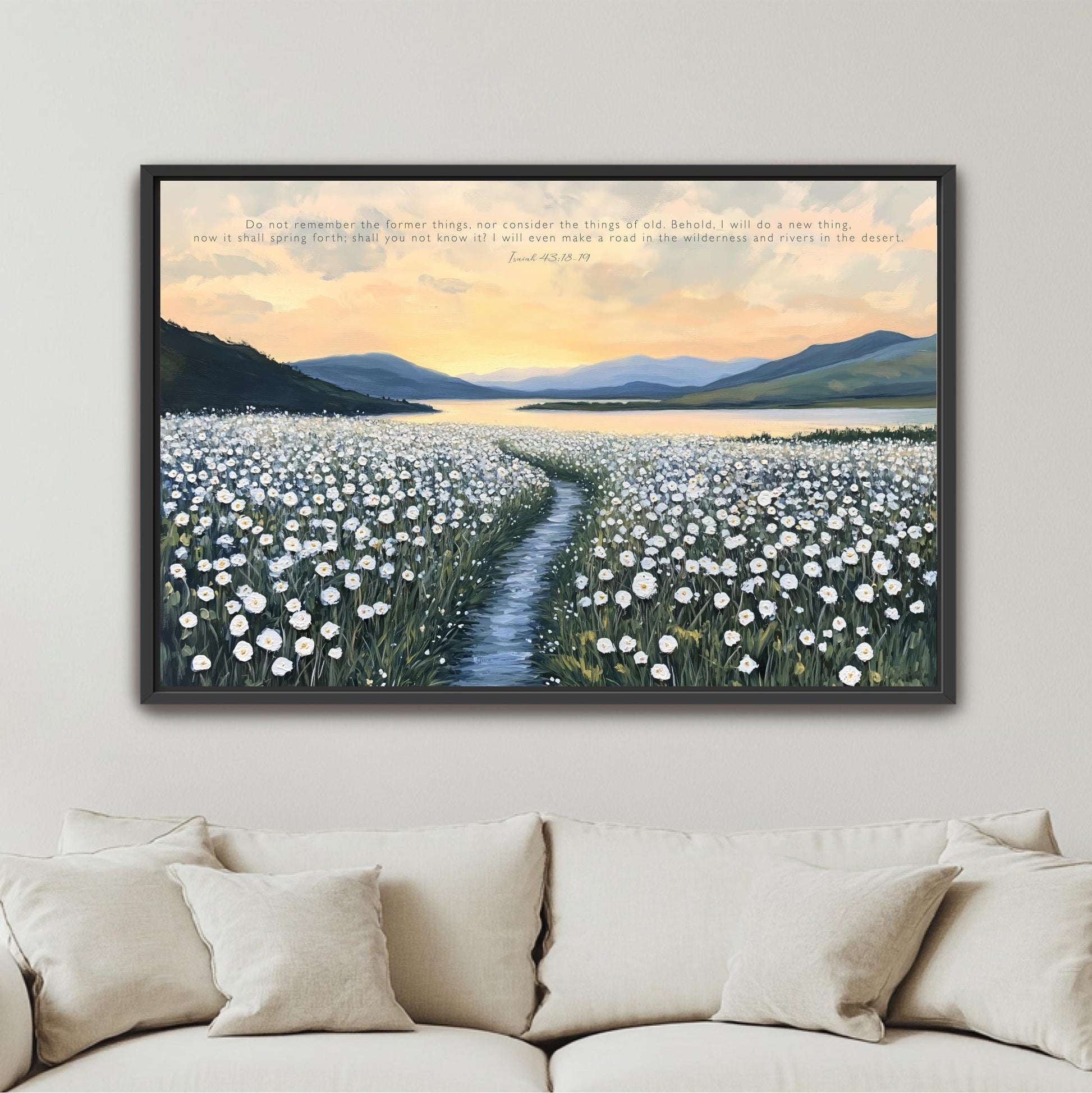 The image is a framed painting depicting a serene landscape with a winding path leading through a field of white flowers, set against a backdrop of mountains and a sunset sky.