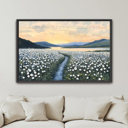 The image is a framed painting depicting a serene landscape with a winding path leading through a field of white flowers, set against a backdrop of mountains and a sunset sky.