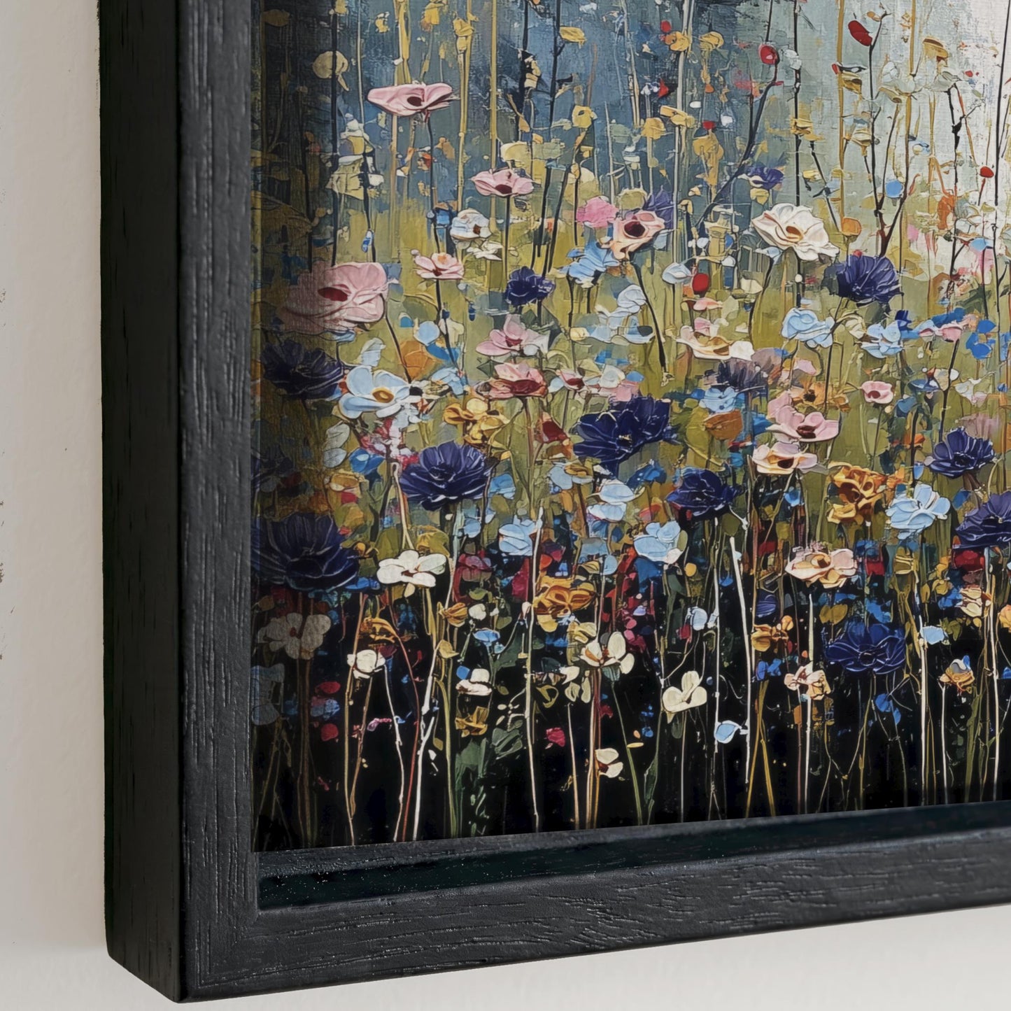 The image is a framed painting depicting a vibrant and colorful field of flowers, with various shades of pink, blue, yellow, and purple blooms.