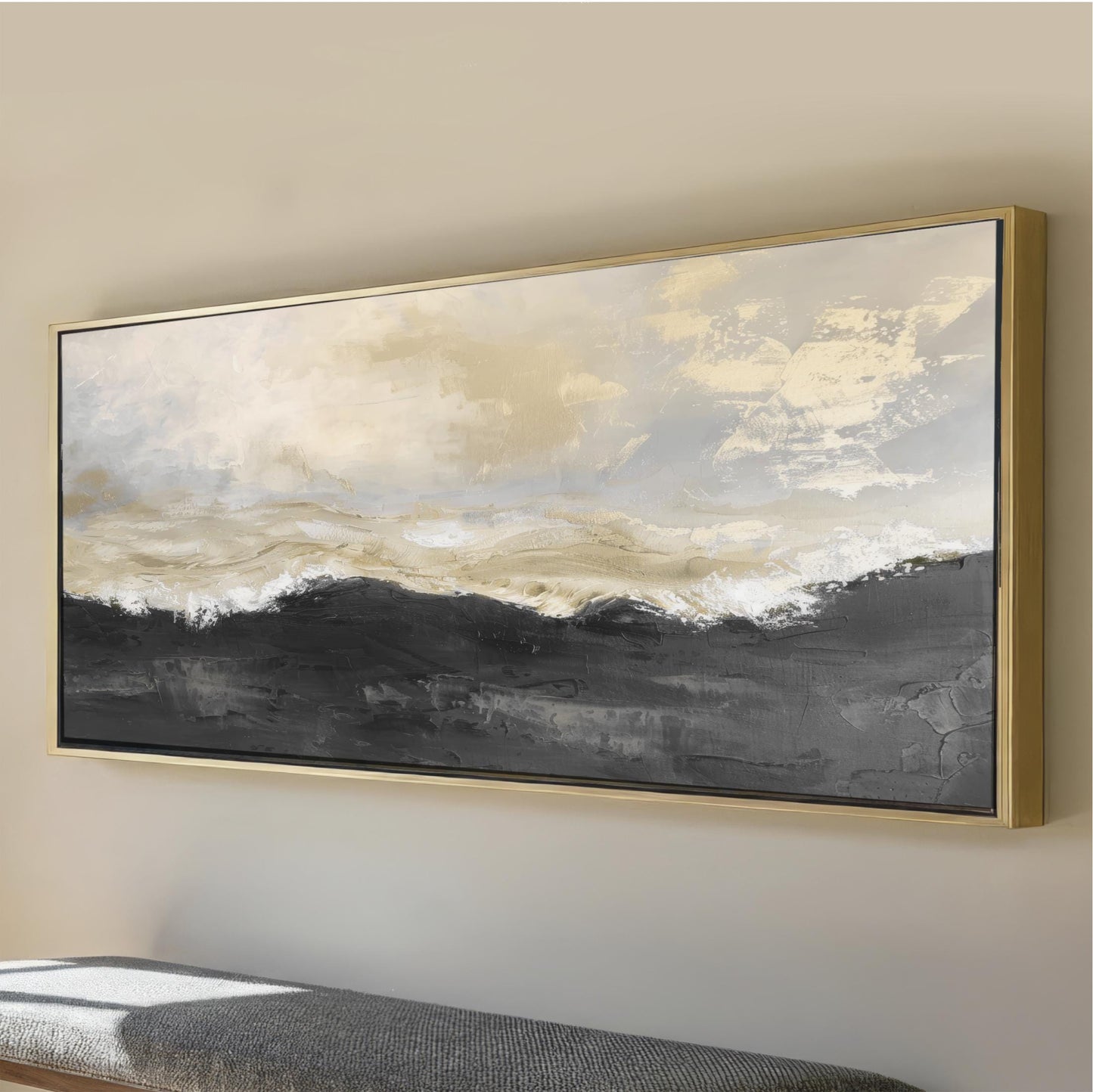 a large, framed painting of a landscape with a cloudy sky and mountains in the background.
