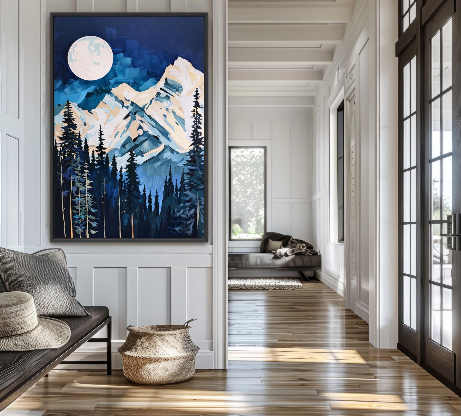 a large painting of a mountain landscape with a full moon, hanging on a wall in a room with a wooden floor and a window.
