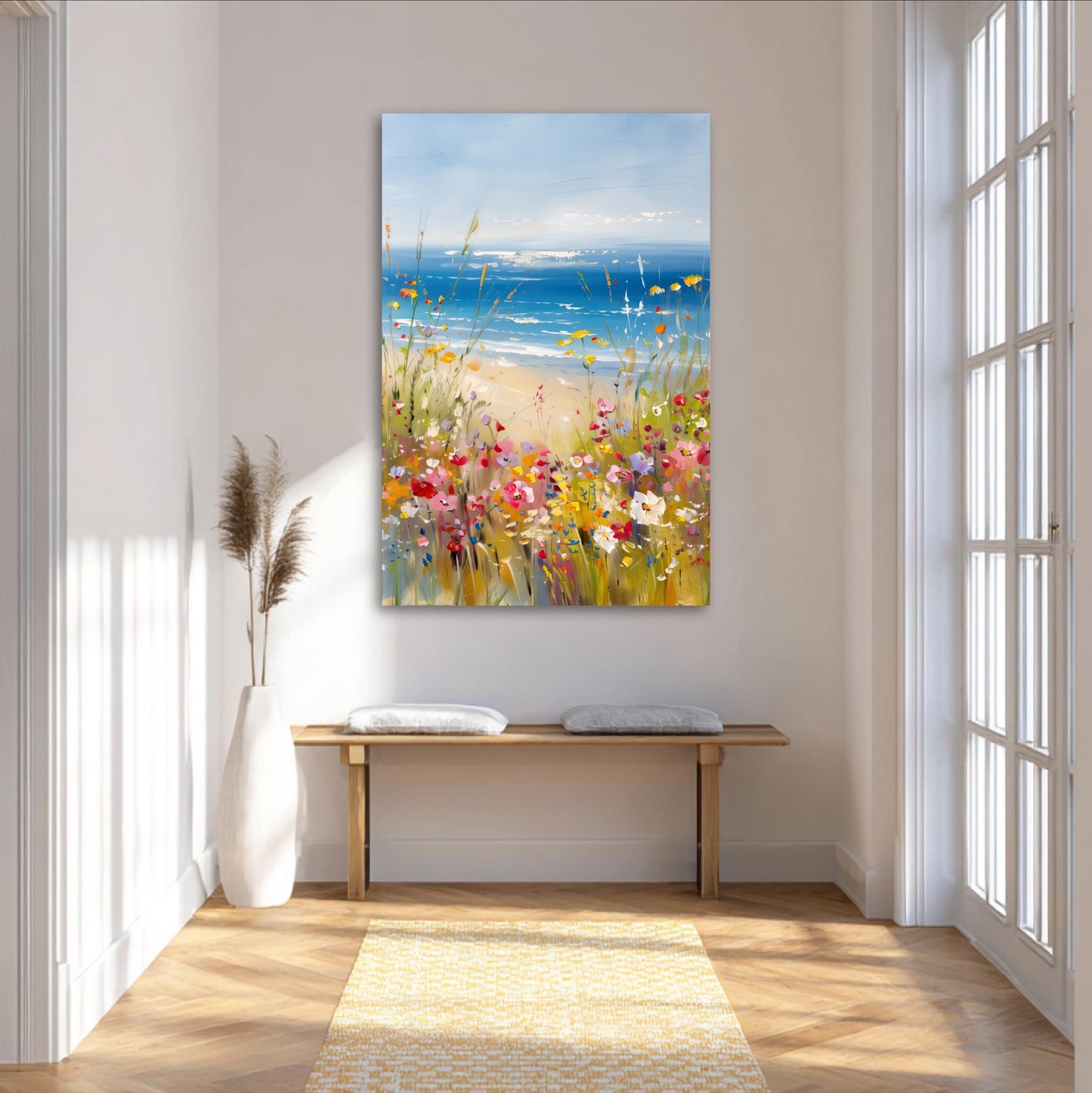 a large painting of a beach scene with a colorful array of flowers and plants, hanging on a wall in a bright and airy room with large windows.