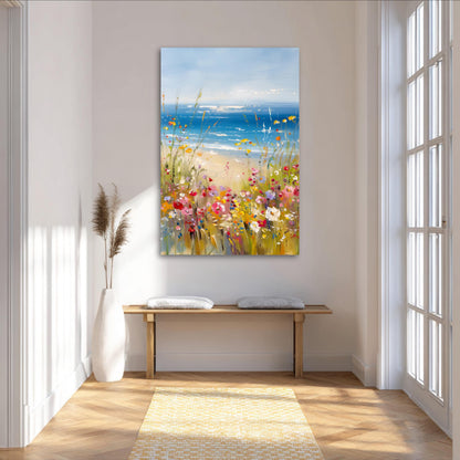 a large painting of a beach scene with a colorful array of flowers and plants, hanging on a wall in a bright and airy room with large windows.