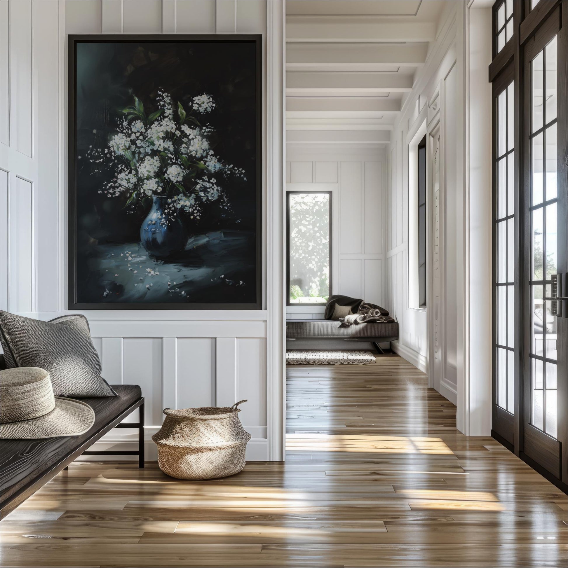 a serene and well-lit hallway with a large painting of a vase filled with white flowers on the wall. The hallway is lined with white walls and features a wooden floor, creating a warm and inviting atmosphere. In the background, there is a couch and a rug, adding to the cozy and comfortable ambiance of the space.