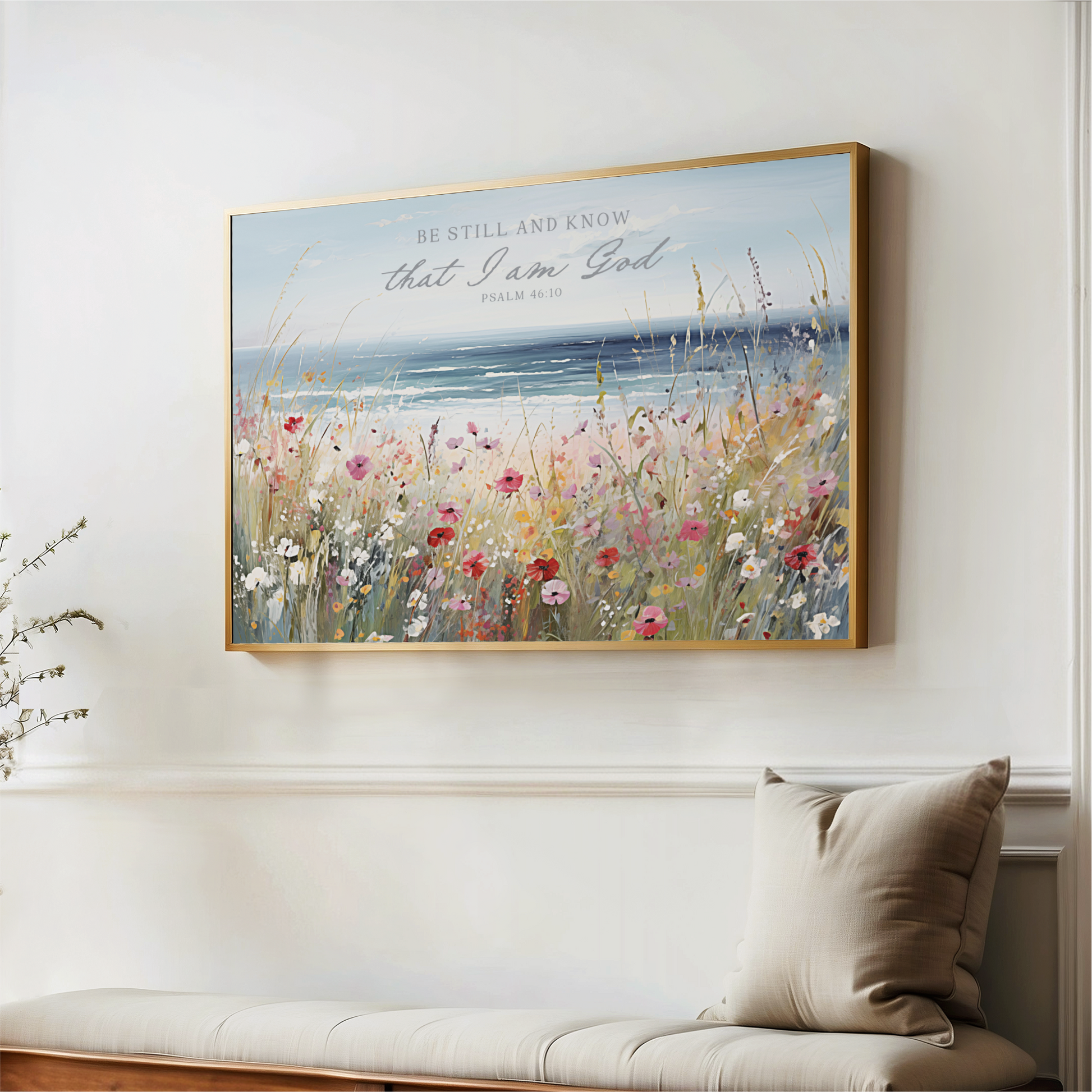 a large framed painting of a field of flowers hanging on a wall.