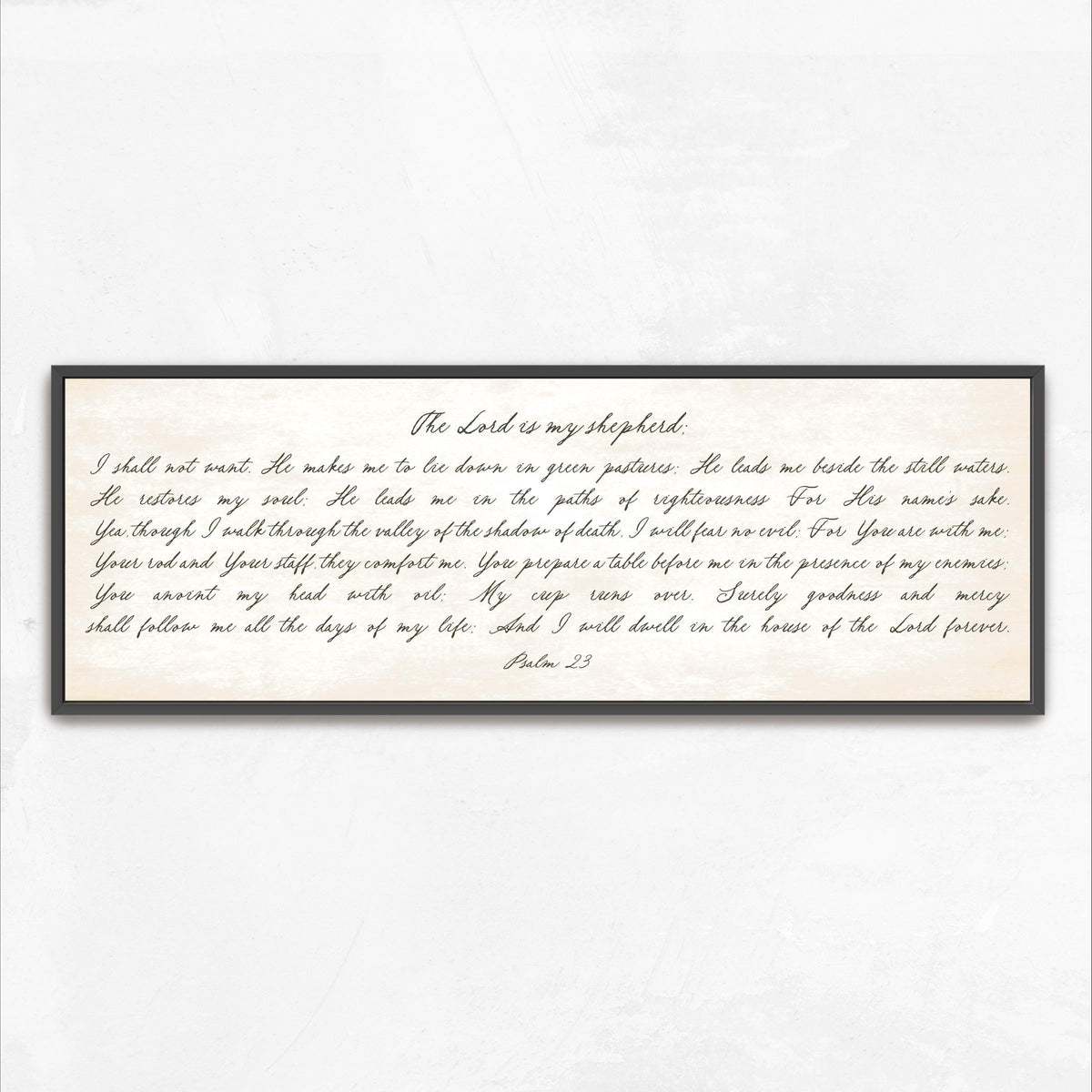 a framed print of a handwritten Bible verse, specifically Psalm 23, which is a passage from the Bible.