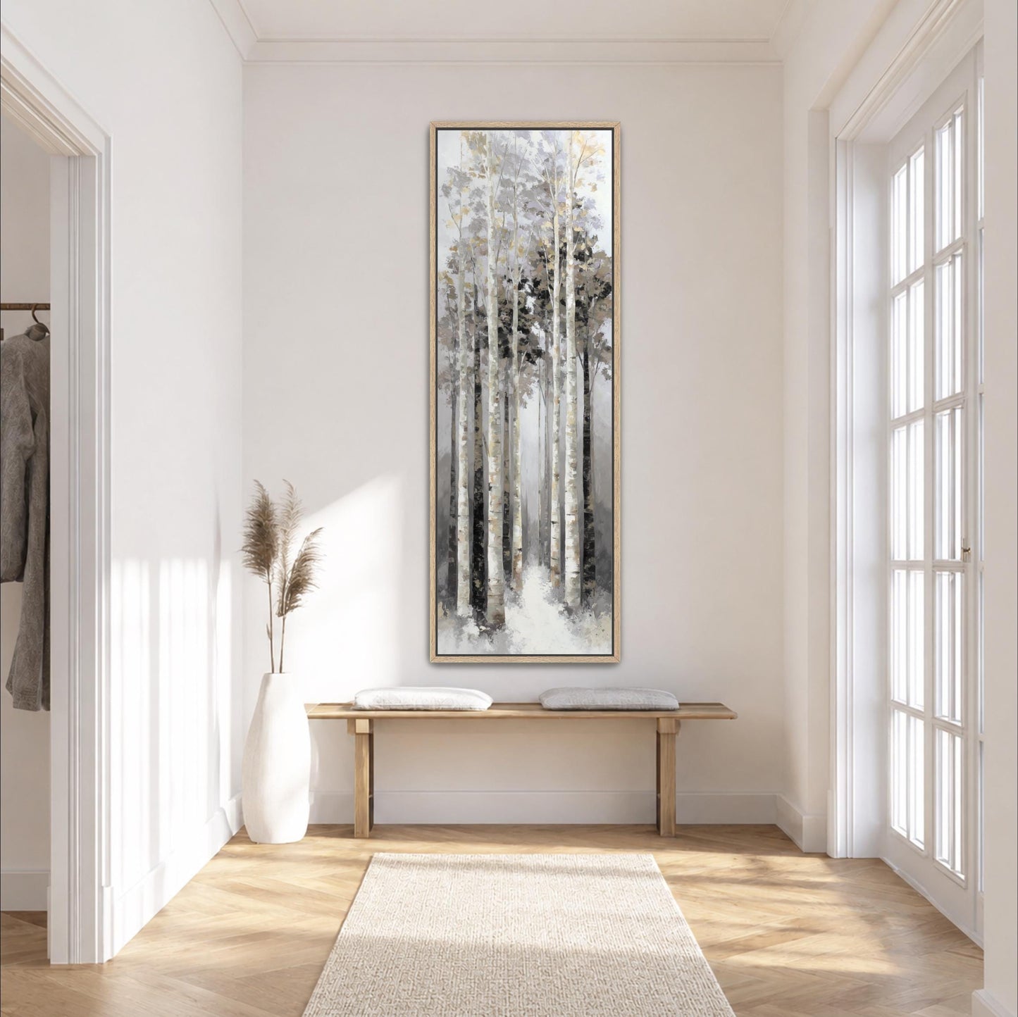 a serene and minimalist hallway with a large painting of a forest scene hanging on the wall. The hallway is well-lit, with natural light streaming in from the windows on the right side. A wooden bench is placed in the center of the hallway, and a white vase with dried flowers is positioned on the left side. The overall atmosphere of the hallway is calm and peaceful, with a sense of tranquility and harmony.
