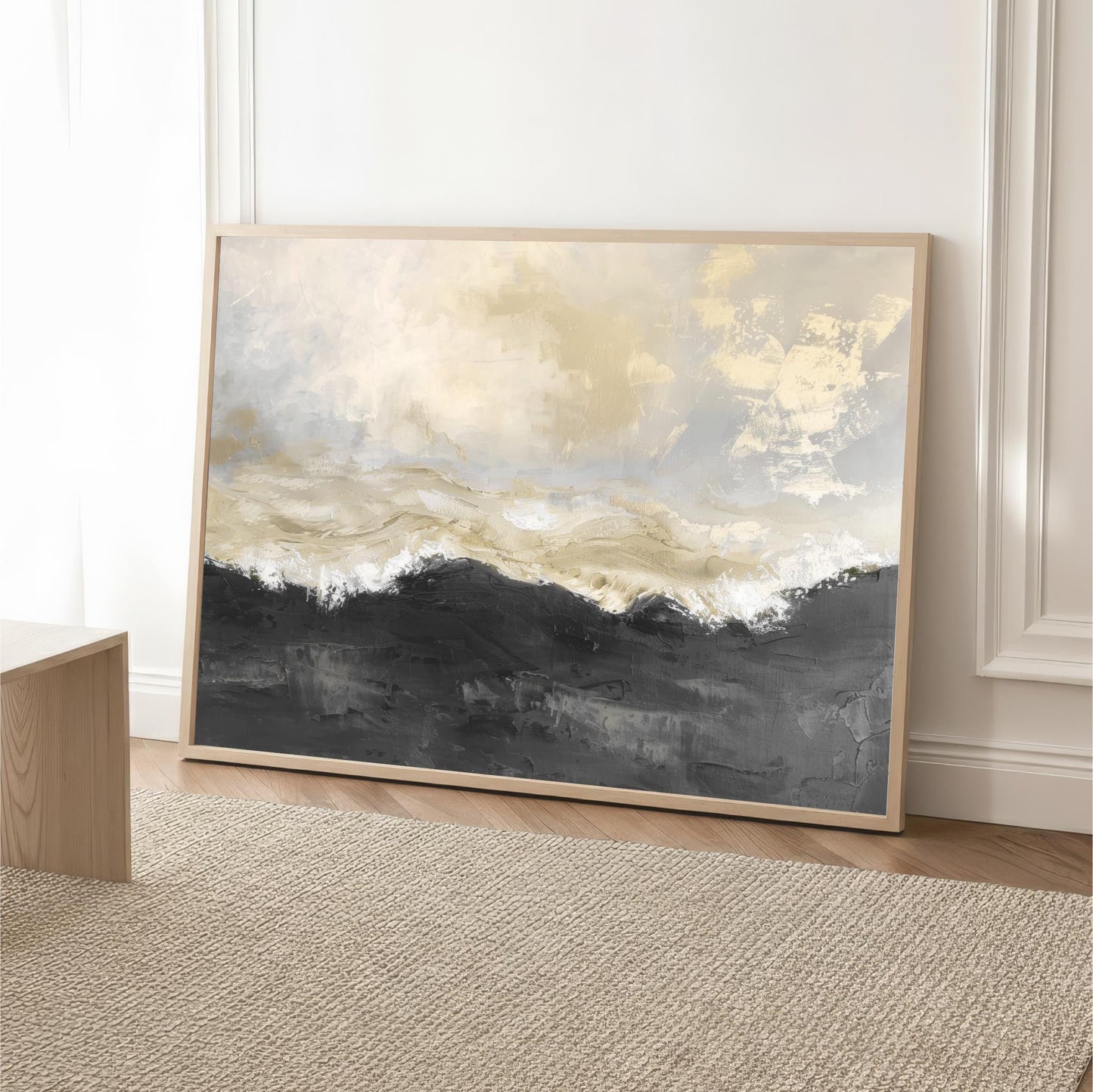 a large, framed painting of a landscape with a mountain range in the background, displayed on a wall in a room with a wooden floor and a beige rug.